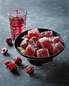 Cherry jelly cubes with coconut