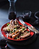 Stuffed neck of lamb with cheese, almonds and sultanas