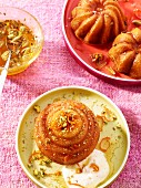 Glazed mini Bundts cakes with orange zest and pistachio nuts
