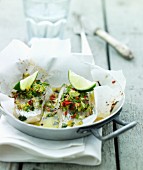 Cod en papillote with limes, vegetables and chilli