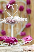 Wire cake stand decorated with purple tulips