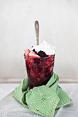 Homemade healthy berry jelly with a dollop of cream
