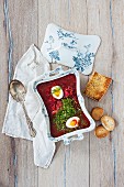Borscht with chicken, egg and grilled bread