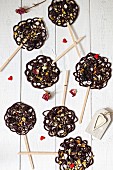 Chocolate lollies with dried fruits