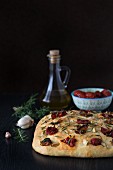 Focaccia with dried tomatoes, garlic, rosemary and olive oil