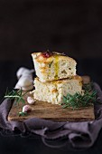Focaccia with dried tomatoes, garlic, rosemary and olive oil