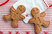 Two gingerbread men on a fabric bag