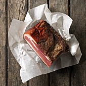 Tyrolean bacon on a piece of paper