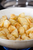 Fried potatoes in a frying pan