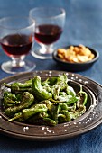 Roasted green chilli peppers with salt and red wine