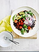 Grilled chorizo with black bean and avocado salad