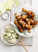 Spiced drumsticks with potato and pickle salad