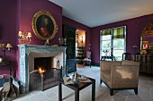 Gilt-framed portrait above fireplace on wall painted purple