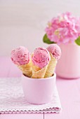 Raspberry ice cream in homemade ice cream cones