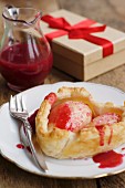 A heart-shaped pear cake with redcurrant sauce