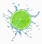A slice of lime with splash of water