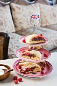 Raspberry and chocolate scones on a cake stand