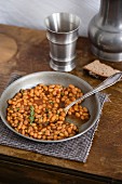 Baked beans on a pewter plate