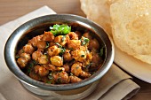 Chole bhatura (spicy chickpeas with fried bread, India)
