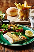 Barramundi fillet with salad and chips