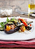 Stuffed aubergines with vegetables, couscous and sheep's cheese