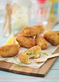 Tuna croquettes on a chopping board