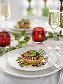 Spicy Christmas tartlet with pomegranate seeds