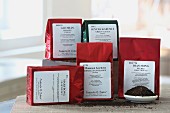 Various types of tea in packages: Sencha Kabuse (Japan), Marybong Darjeeling (India), Gao Shan Oolong (Taiwan), Dian Hong Needle (China), Monsoon Gardens Himalayan Orange (Nepal)