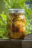 Homemade pickled vegetables in a preserving jar