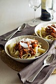 Pasta with a meat sauce and Parmesan cheese