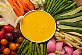 Raw and cooked vegetables with a turmeric dip