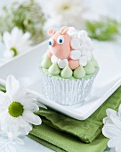A cupcake decorated with a marshmallow fondant sheep