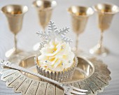 A festive Christmas cupcake with silver fondant snowflake