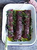 Marinated venison fillets with olive oil and herbs
