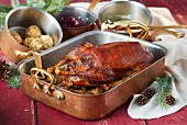 Stuffed Christmas goose in a roasting tin
