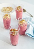 Strawberry yoghurt smoothies topped with muesli