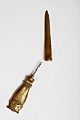 A brass corkscrew with an owl shaped handle and a letter opener, 1960s (Von Kunow Collection)