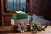 Hand-made festive paper flowers decorating gift boxes
