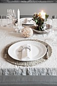 Place setting on festively set dining table