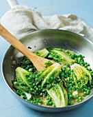 Braised lettuce with peas and white wine