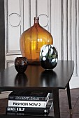 Coloured glass vases on vintage-style black table
