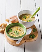Sweetcorn and coconut soup with lemongrass in two bowls