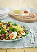 Egg salad with vegetables and bacon for Easter