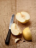 Nashi pears, sliced, on a wooden surface