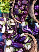 Baskets of aubergines at a farmers market