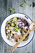 Rustic potato salad with red onions, spring onions and herb quark