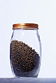 A jar of black peppercorns