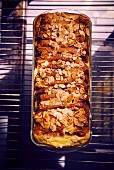 Pain perdu terrine with flaked almonds (seen from above)