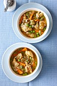 Chicken soup with peas, carrots and rice