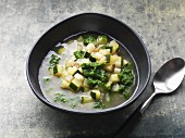 Vegan courgette soup with parsley root and parsley oil